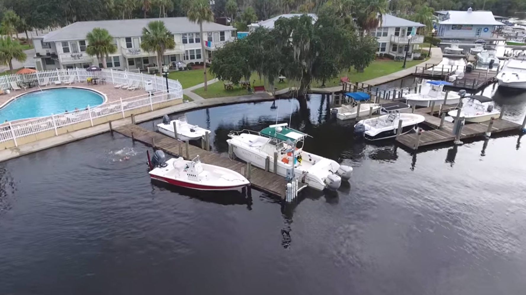 a boat is docked next to a body of water