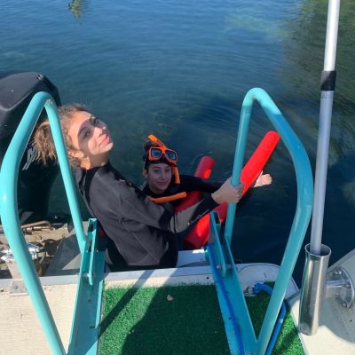 a chair sitting in front of a body of water