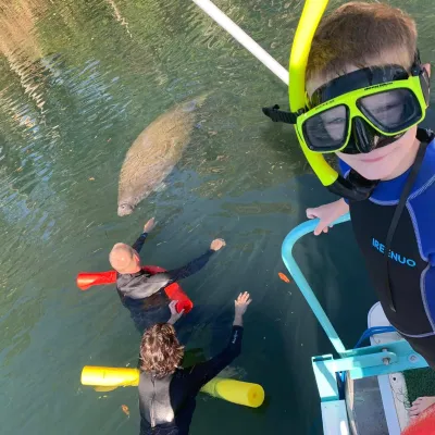 a child swimming in a body of water