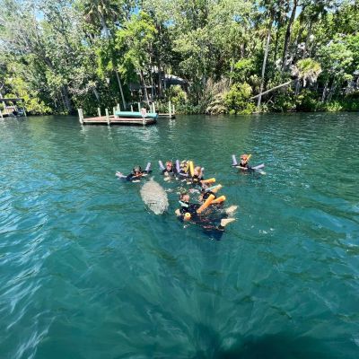 a group of people on a boat in the water