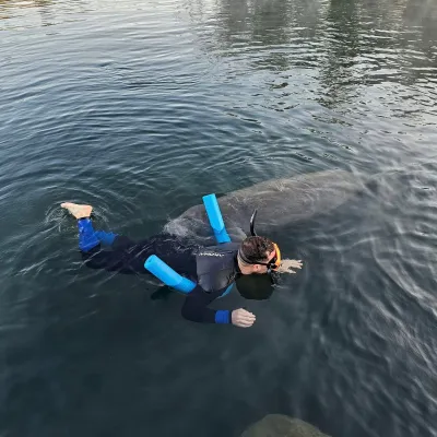a person riding on top of a body of water